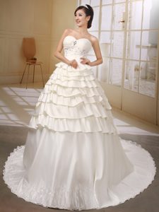 Attractive Sweetheart Beaded and Ruffled Satin Fall Wedding Dress in Ivory